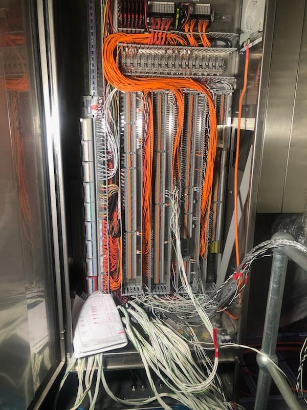Complex commercial and industrial control cabinet with organised control wiring and terminations
